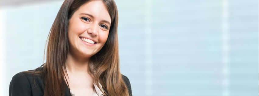 Young business woman standing in office