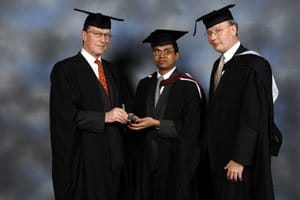 Dhiren Chandrakant Chauhan (centre) with Mr Shenfield and Mr Lewis