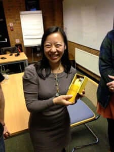 Linda Cheung receives an eco-mouse from BBE students