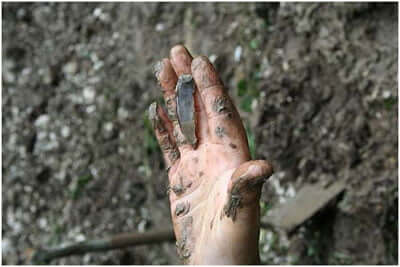 hand-with-Mesolithic-tool