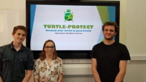 computing students presenting in a competition