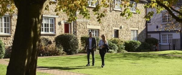 Two students walking around the campus