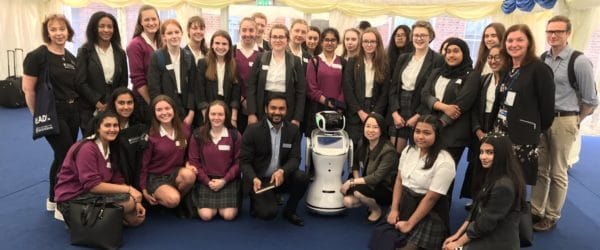 Pupilsfrom Bedford School for Girls taking part in a workshop with a robot