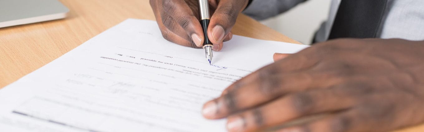Man signing a document