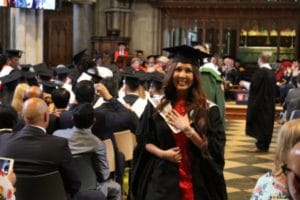 Female student celebrating after graduation