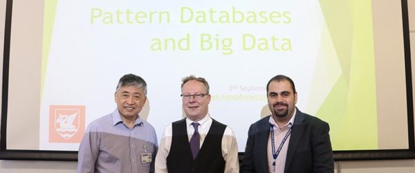 Staff giving a presentation on pattern data and big databases