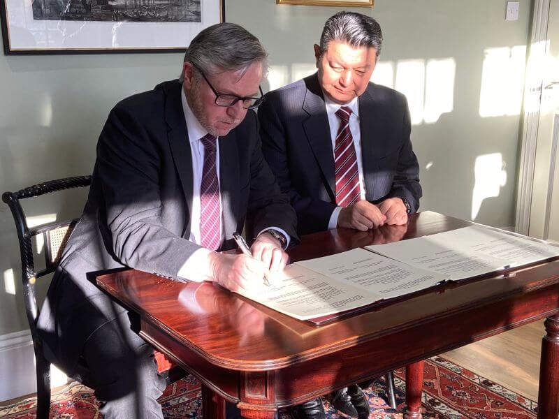 Julian Richards signing Memorandum of Understanding