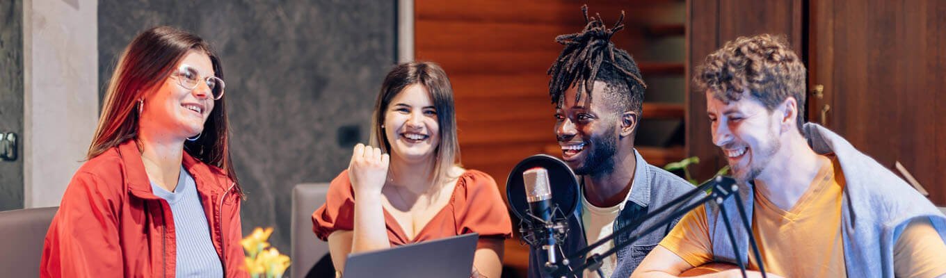 Group of young students in podcast/audio studio