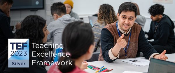 TEF 2023 Silver logo - Teaching Excellence Frameowkork, overlayed over image of teacher mentoring students