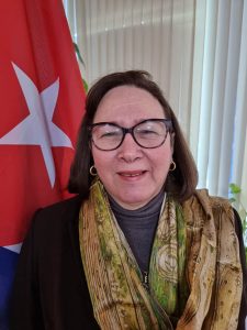 Portrait photograph of Her Excellency Barbara Montalvo Alvarez, smiling to camera