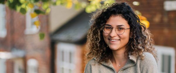 Female student in Buckingham, smiling to camera