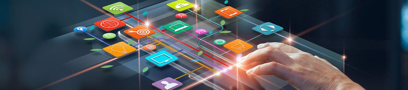 Abstract photograph of person's hand holding tablet device, finger touching the screen with colourful digital icons above the device