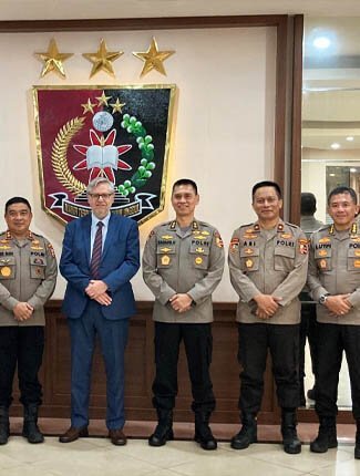 Professor Julian Richards with Indonesian Police officers