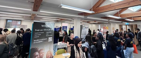 People gathered around various stalls and displays at Buckingham Law Fair 2024
