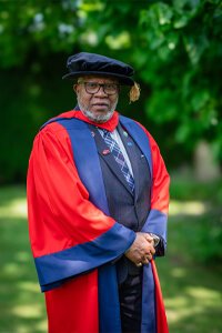 Mr Dennis Francis in graduation robes
