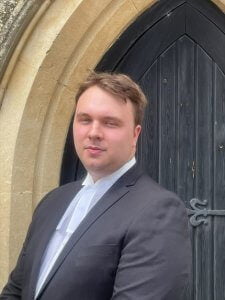 Portrait photograph of Oliver Hall outside the Radcliffe Centre