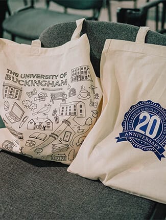 The University of Buckingham tote bag and 20 years celebratory tote bag