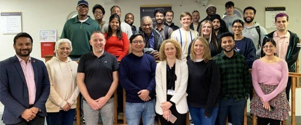 Large group of people smiling to camera - 2024's cohort of MSc Applied Data Science Degree Apprenticeship students and staff