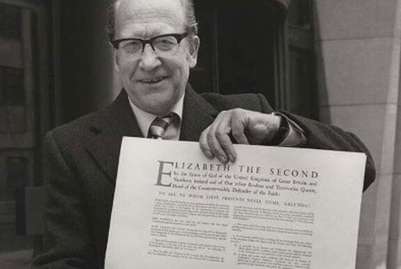 Vice Chancellor Professor Sir Alan Peacock with the Royal Charter in 1983. © The University of Buckingham