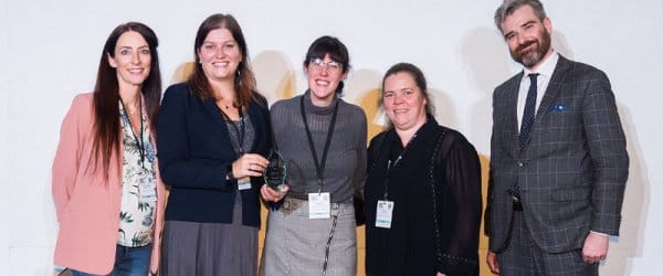 Buckingham staff being awarded IHE Award, group of people