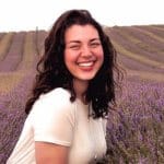 Bethan Garratt, smiling to camera in lavender field