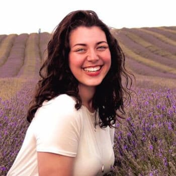 Bethan Garratt, smiling to camera in lavender field