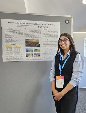 Madara standing in front of her poster, titled 'Photovoltaic Digital Twins using Game Engine Simulations'.