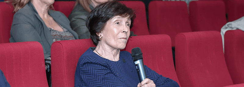 Dame Mary Archer in audience, speaking with microphone