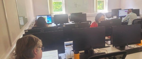 CA team working at PCs in office