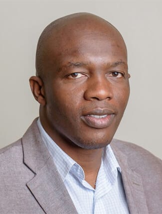 Professional portrait photograph of Dr Brian Penduka