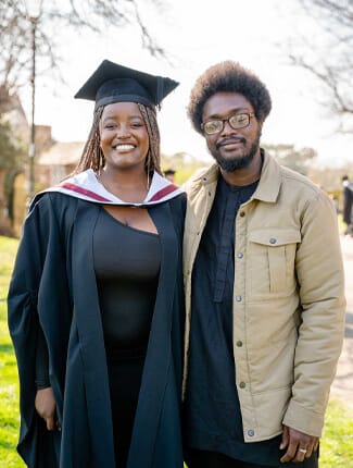 Malindi Mwangi, in graduation cap and gown, alongside Zackari Lawanson