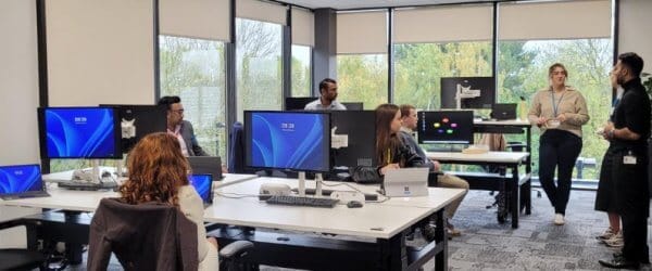 Buckingham students at a professional mentoring session, in modern office