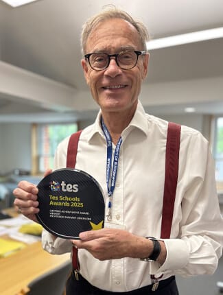 Professor Barnaby Lenon holding his Lifetime Achievement Award