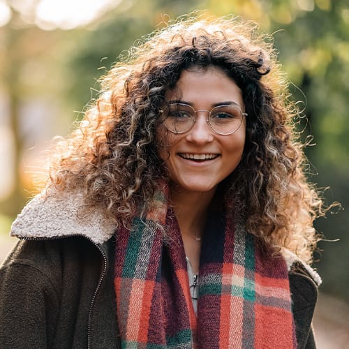 Female student, Karina, smiling to camera