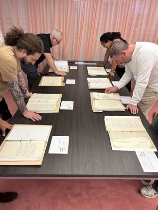 BUCSIS students viewing documents at the National Archives