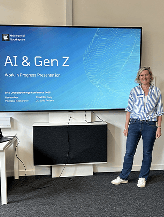 Charlotte Carry standing in front of her presentation 'AI & Gen Z' 