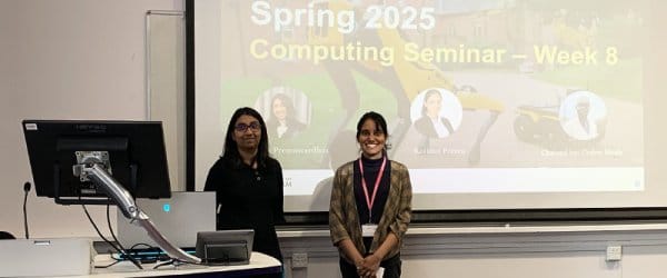 Two candidates presenting during a Computing seminar