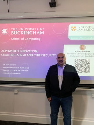 Dr Ali Al-Sherbaz in front of his presentation screen