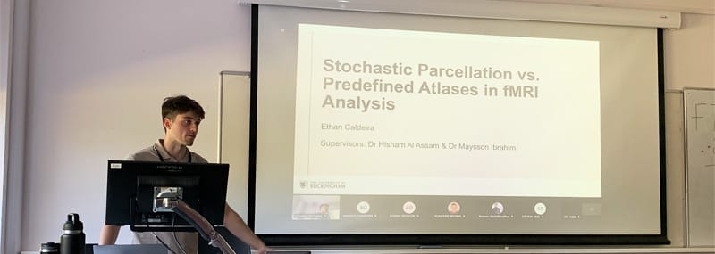 Ethan presenting on his project: 'Stochastic Parcellation vs. Predefined Atlases in fMRI Analysis