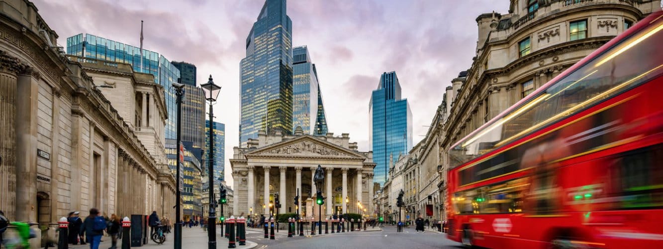 Evening in London, view of bus driving past and Bank of England