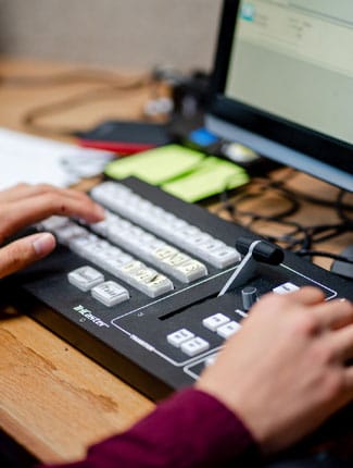 Person using video switcher equipment