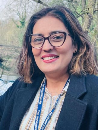 Shazia next to the River Ouse on Buckingham campus