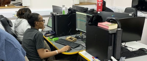 Students working at their computers in computing suite