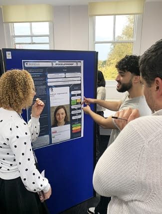 Student explaining contents of poster