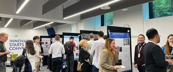 Attendees viewing posters around the conference