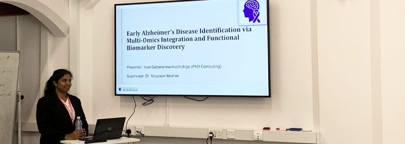 Isuri with presentation slide on Alzheimer’s disease identification using multi-omics data and interpretable artificial intelligence
