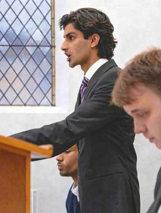 Musa speaking in Buckingham's Moot Court