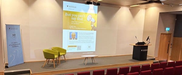 The Vinson Auditorium set up for the Masterclass Lecture. The title of the slide being presented reads: "But you can't say that..."